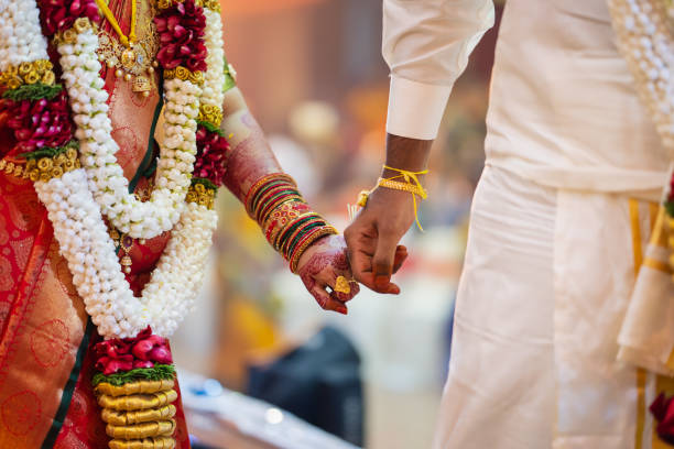 South Indian bride in traditional silk saree with gold jewelry