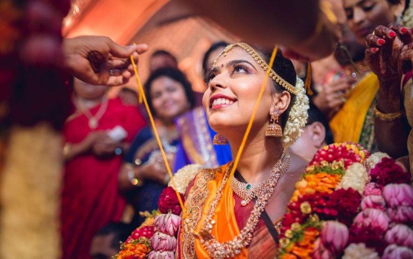 South Indian wedding couple performing traditional rituals