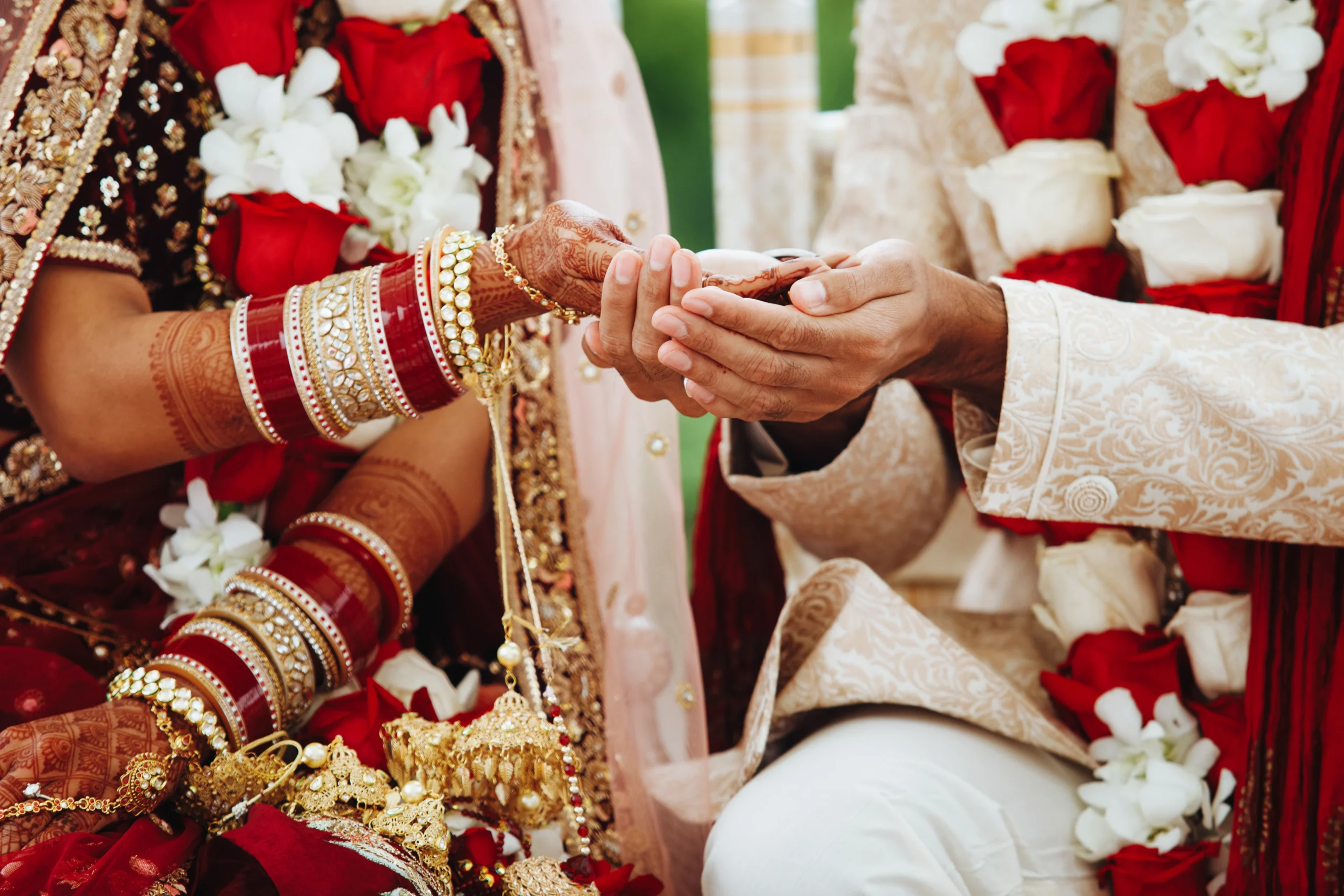 South Indian bride and groom hands intertwined in wedding ritual